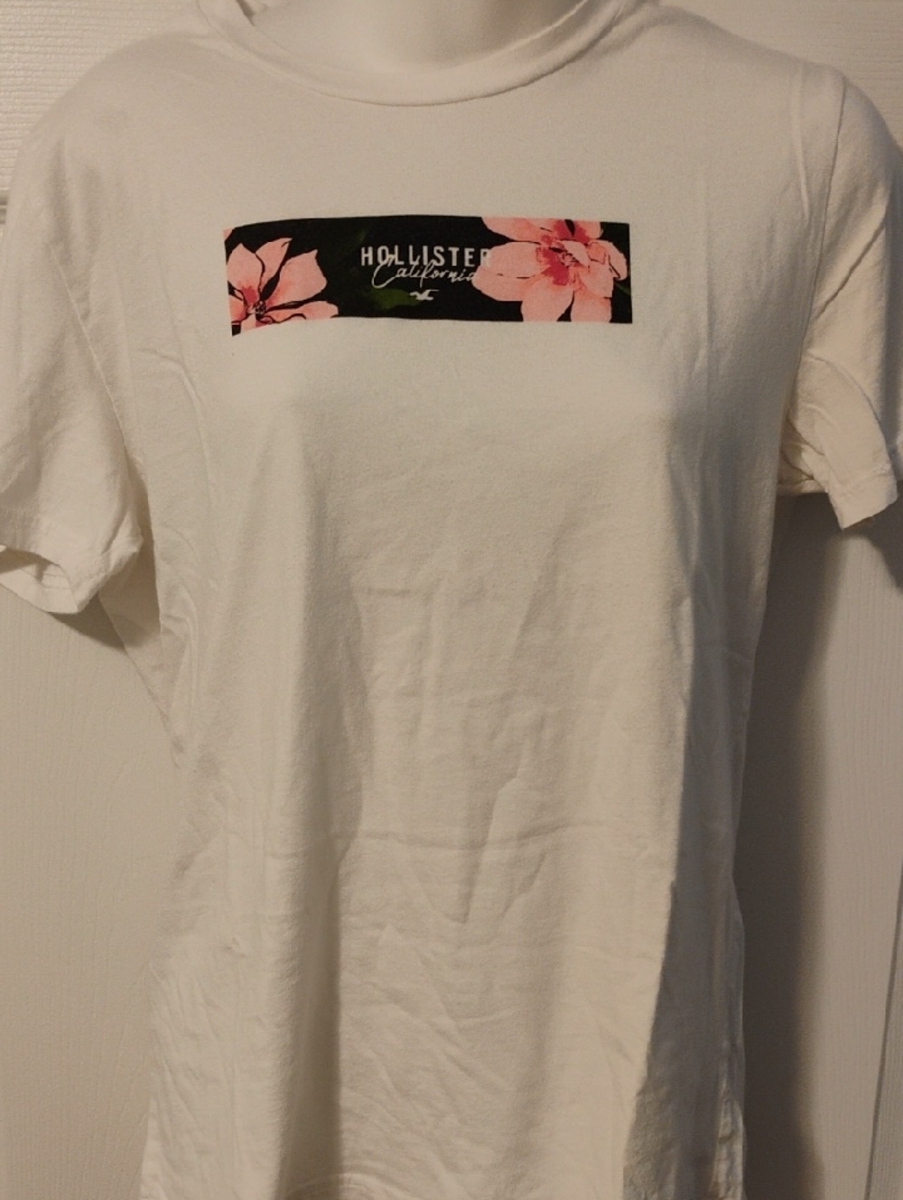 Hollister White Tee with Black Floral Logo Stripe